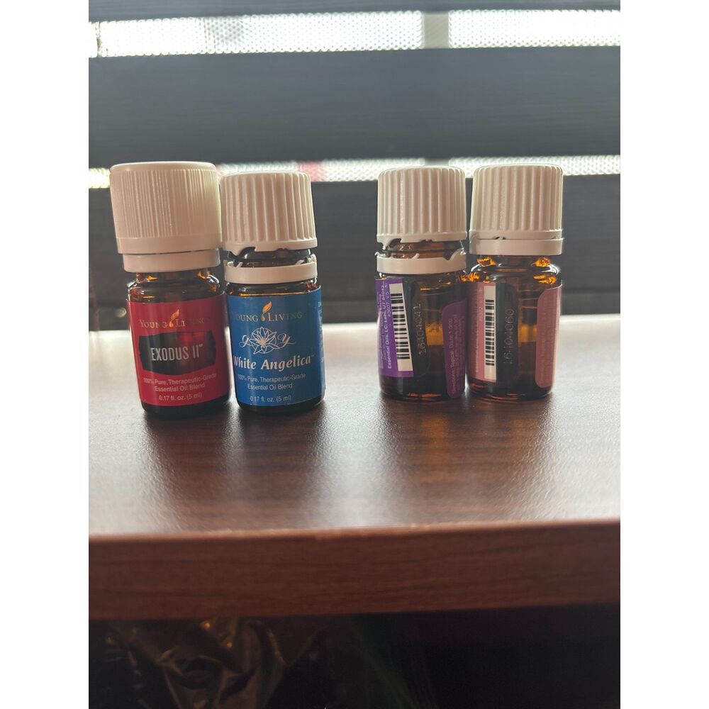 Young Living Essential Oil exodus, white angelica, palo santo, manuka oils
